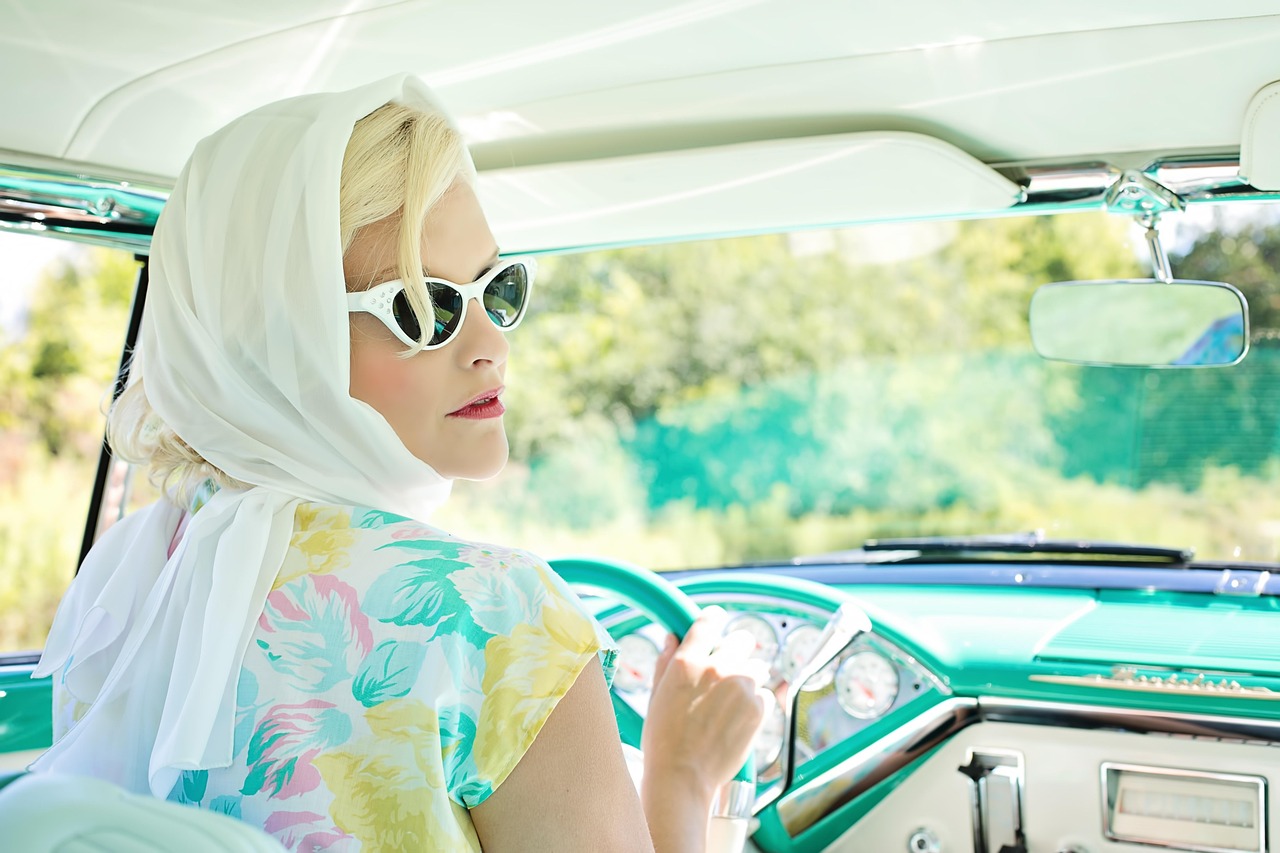 lady driving an old car