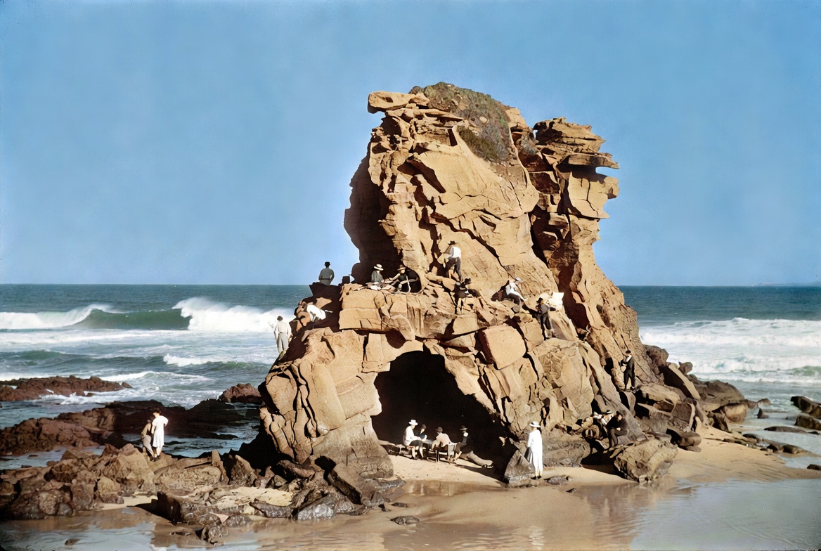 Here's a generated historical-style image of Cave Rock on Durban's Bluff as it appeared in its prime (early 20th century), before its destruction during WWII.