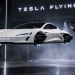 Tesla’s second-generation Roadster is set for a public unveil on October 1, 2026 (“Go for launch”), with heavy emphasis on optional SpaceX-developed cold-gas thrusters that enable extreme acceleration and limited hovering/short lifts—but it is not a true flying car capable of sustained flight or everyday aerial travel.