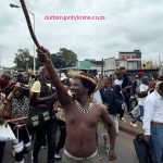 Protest leader MaGolide has been arrested, according to police, for allegedly threatening to shut down Moses Mabhida Stadium and disrupt the MTN8 match between Orlando Pirates and Mamelodi Sundowns. Police allege that he had gathered protesters at King Dinuzulu Park to march to the stadium and enforce the shutdown.