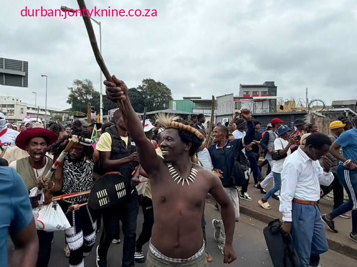 Protest leader MaGolide has been arrested, according to police, for allegedly threatening to shut down Moses Mabhida Stadium and disrupt the MTN8 match between Orlando Pirates and Mamelodi Sundowns. Police allege that he had gathered protesters at King Dinuzulu Park to march to the stadium and enforce the shutdown.