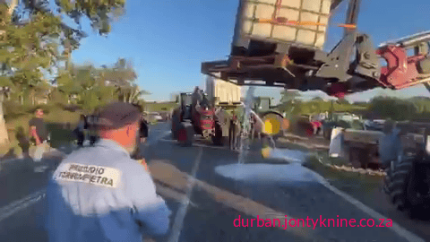 Furious farmers near Rome dump milk on the ground because they cannot make ends meet